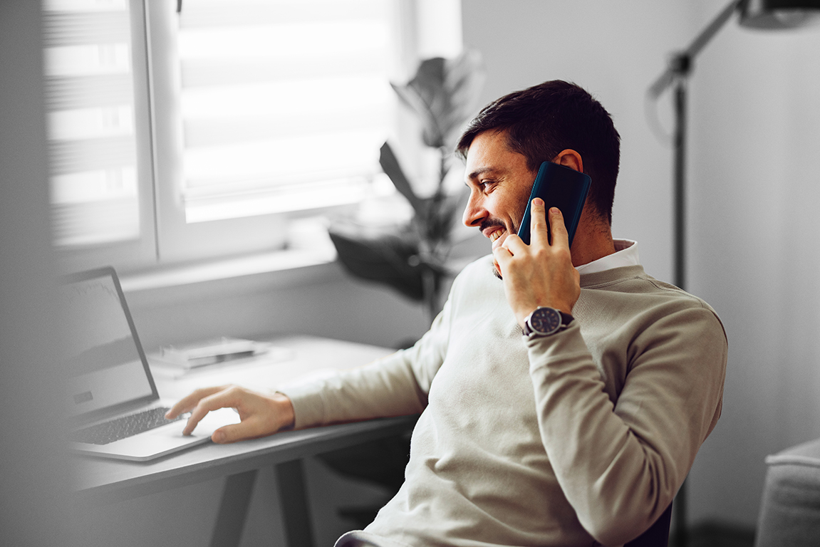 Person on call looking at laptop