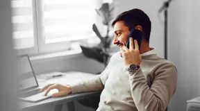 Person on call looking at laptop