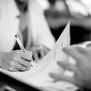 Person signing contract 