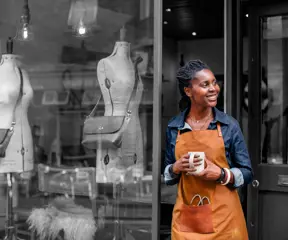 Business owner outside shop 