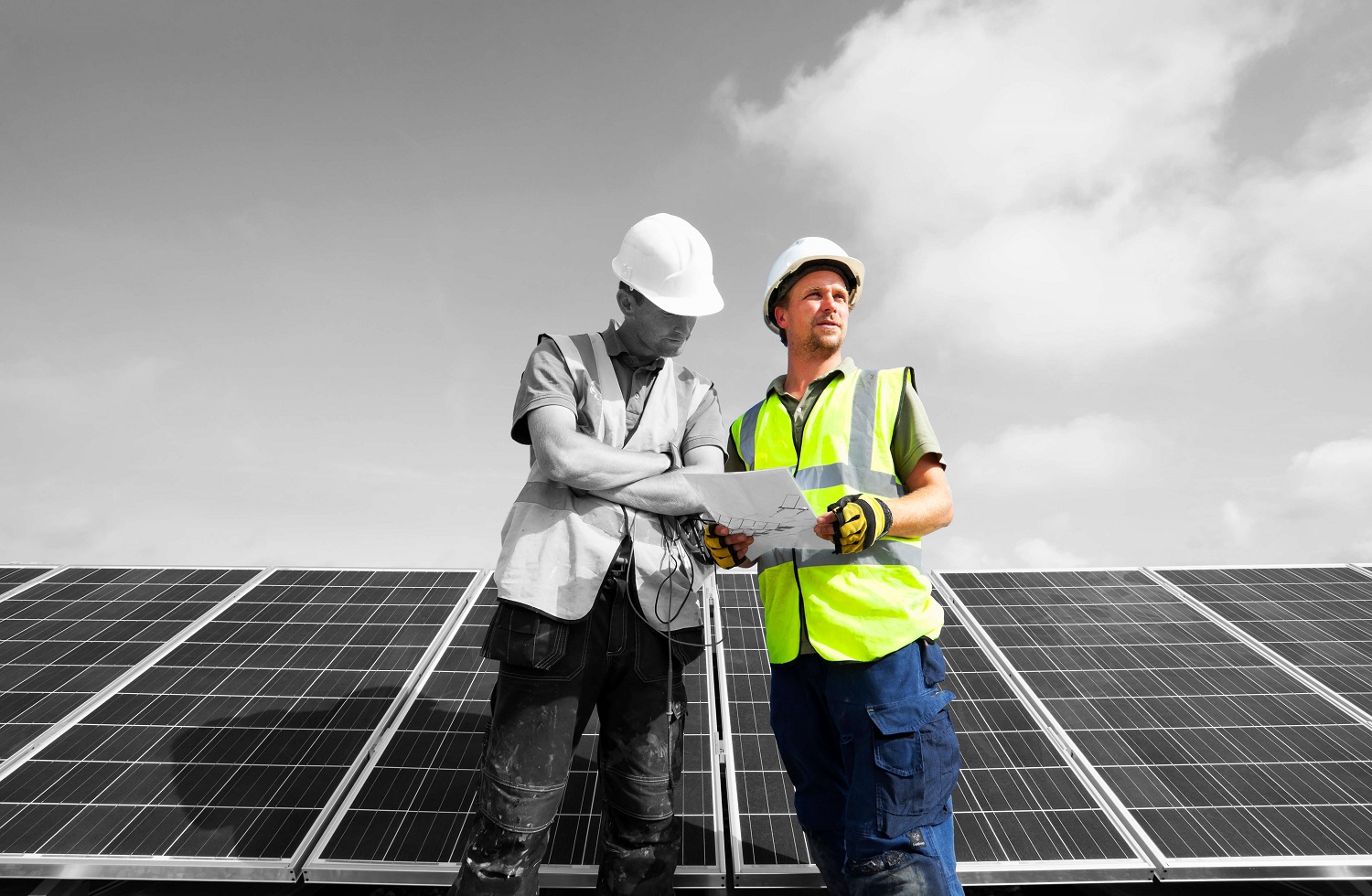 Engineers looking at solar panel plans