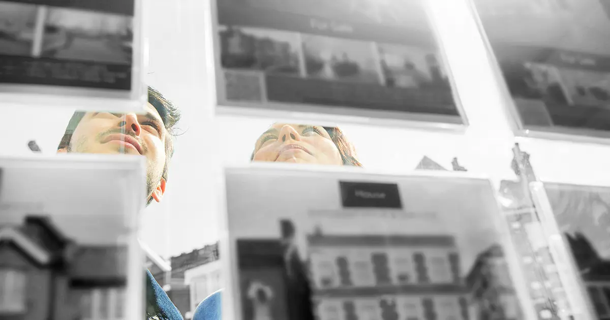 Couple looking at property listings