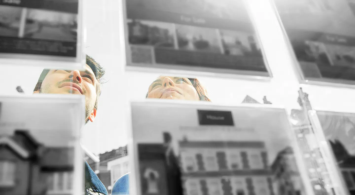 Couple looking at property listings