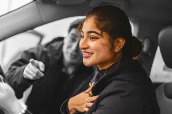 Happy person collecting new car