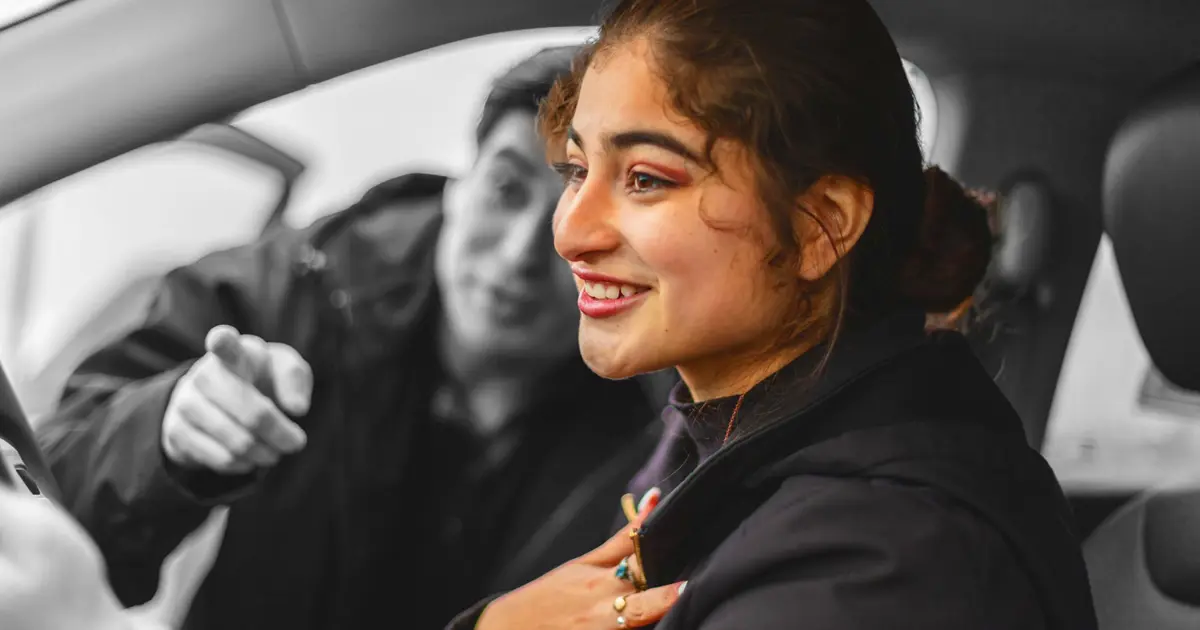 Happy person collecting new car
