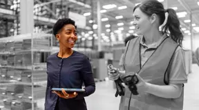 Two people in a factory