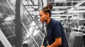 Person making solar panels