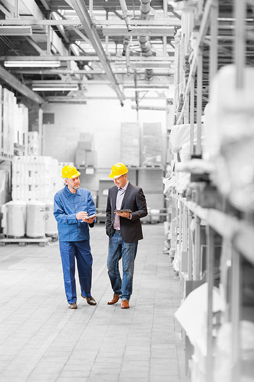 People walking through warehouse