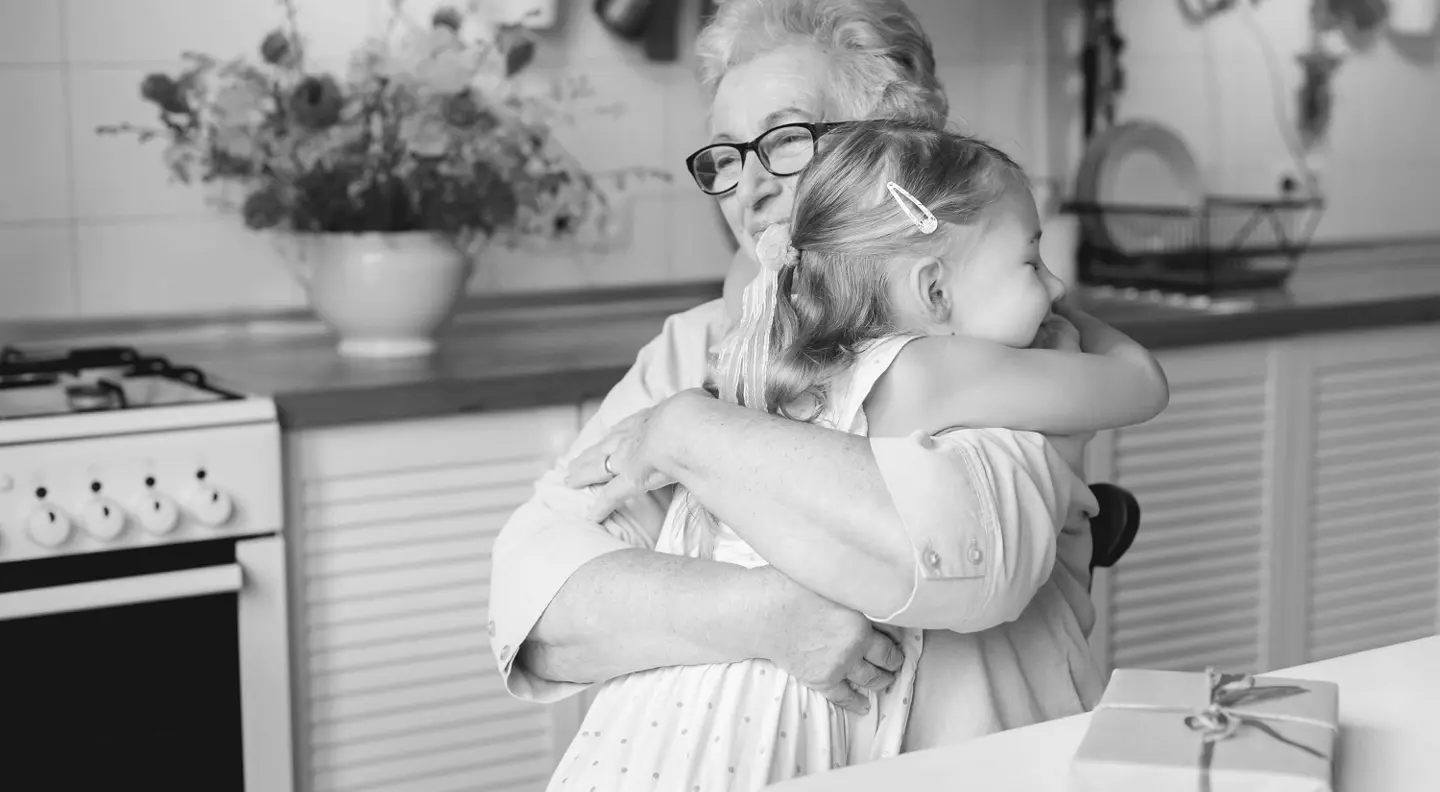 Woman hugging young girl 