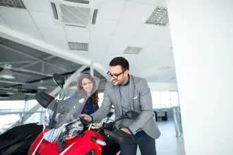 Couple buying a motorbike