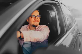Person driving new car