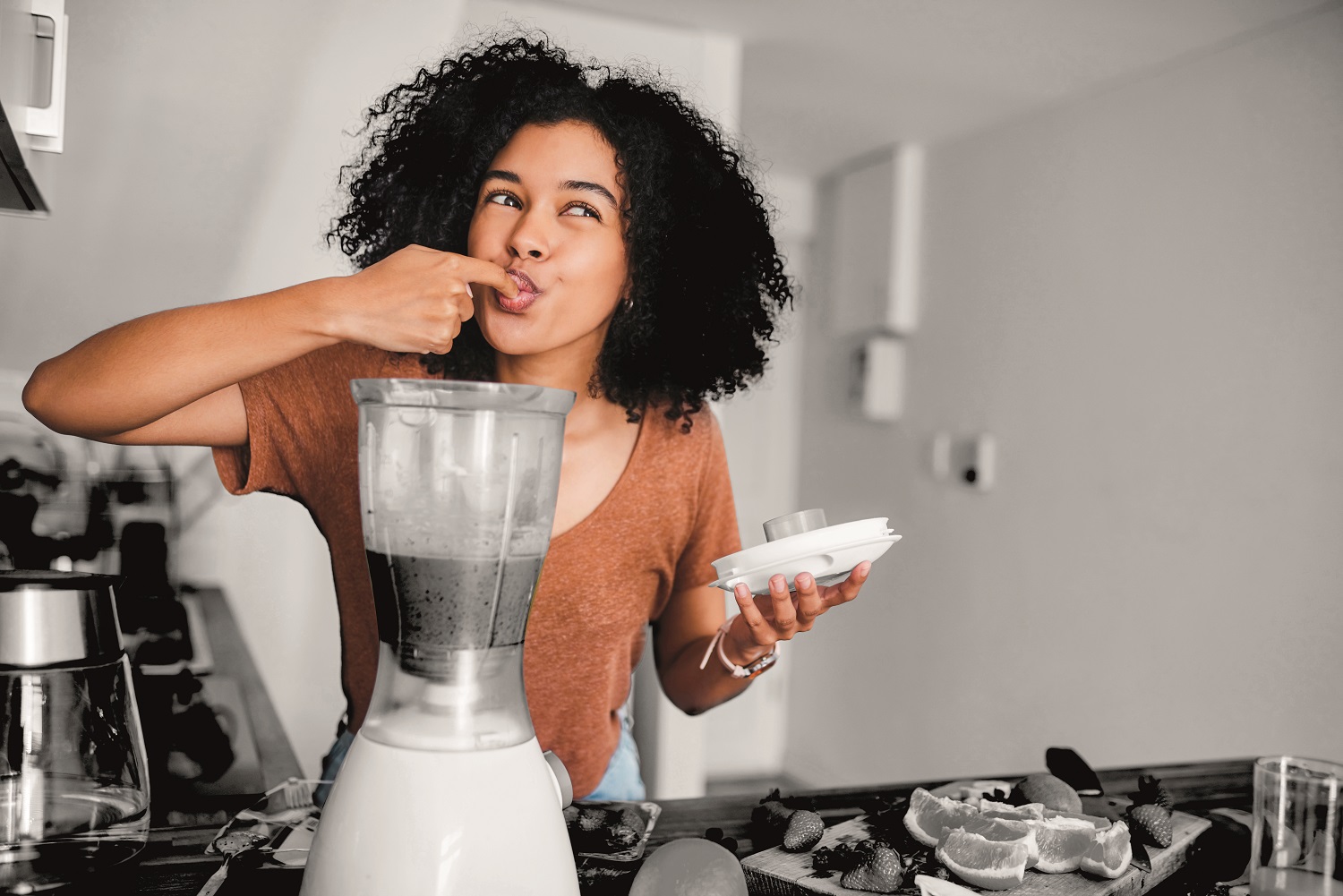Person enjoying a freshly made smoothie