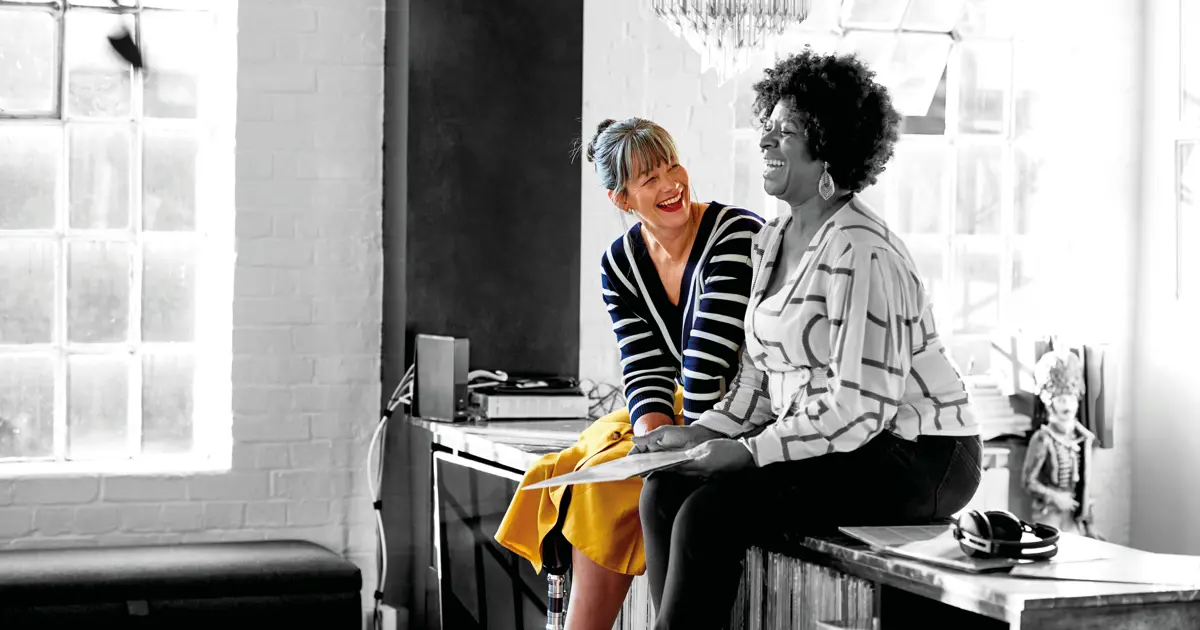 Two friends laughing together